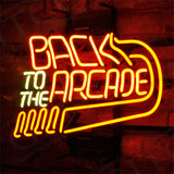 Back to The Arcade Neon Sign featuring bright neon pink lettering with a black metal grid background