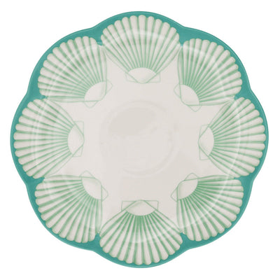 Set of Balearic Blu dinner plates with scalloped edges and sea-blue shell design, arranged on a table.
