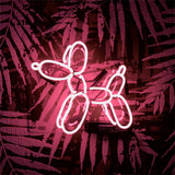 Illuminated Balloon Dog neon light mounted on acrylic backing in an interior setting