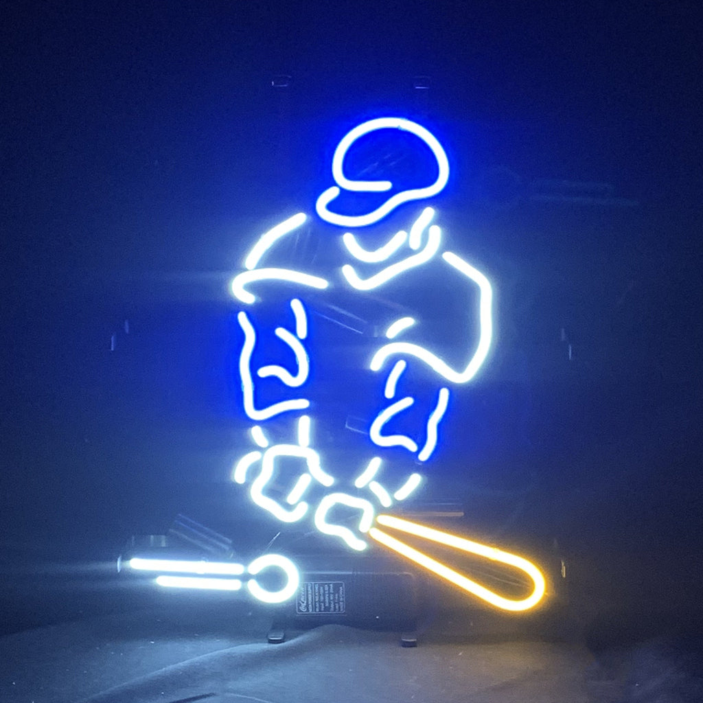 Baseball Player Neon Light Sign mounted on a wall with glowing orange and white neon tubing