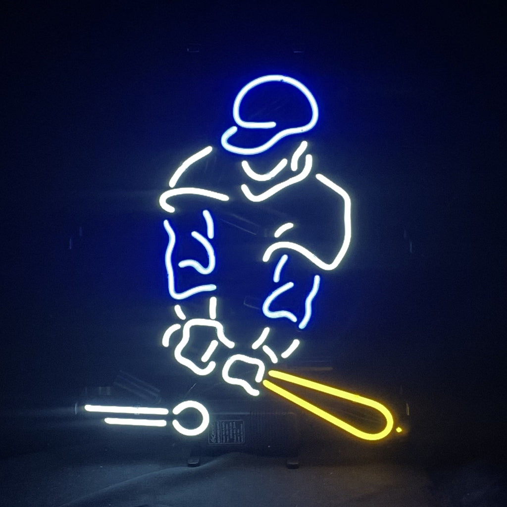Neon light sign depicting a baseball player in blue and white outline with a yellow bat and a white baseball in front.