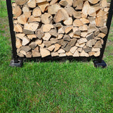 Black and brown firewood rack support bases stacked on concrete and grass surfaces