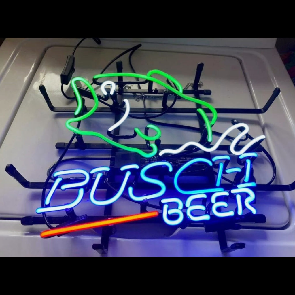 Bass Fish Busch Beer neon sign light mounted on a dark wall showing glowing bass fish and Busch Beer logo in neon tubing