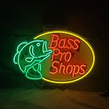 Neon sign with a green bass fish outline on the left and red 'Bass Pro Shops' text inside a yellow oval frame on a dark background.