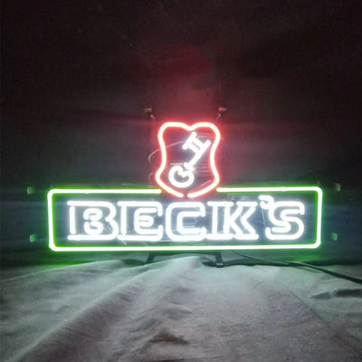 Beck's Beer Neon Light Sign glowing on a metal grid with a hanging chain