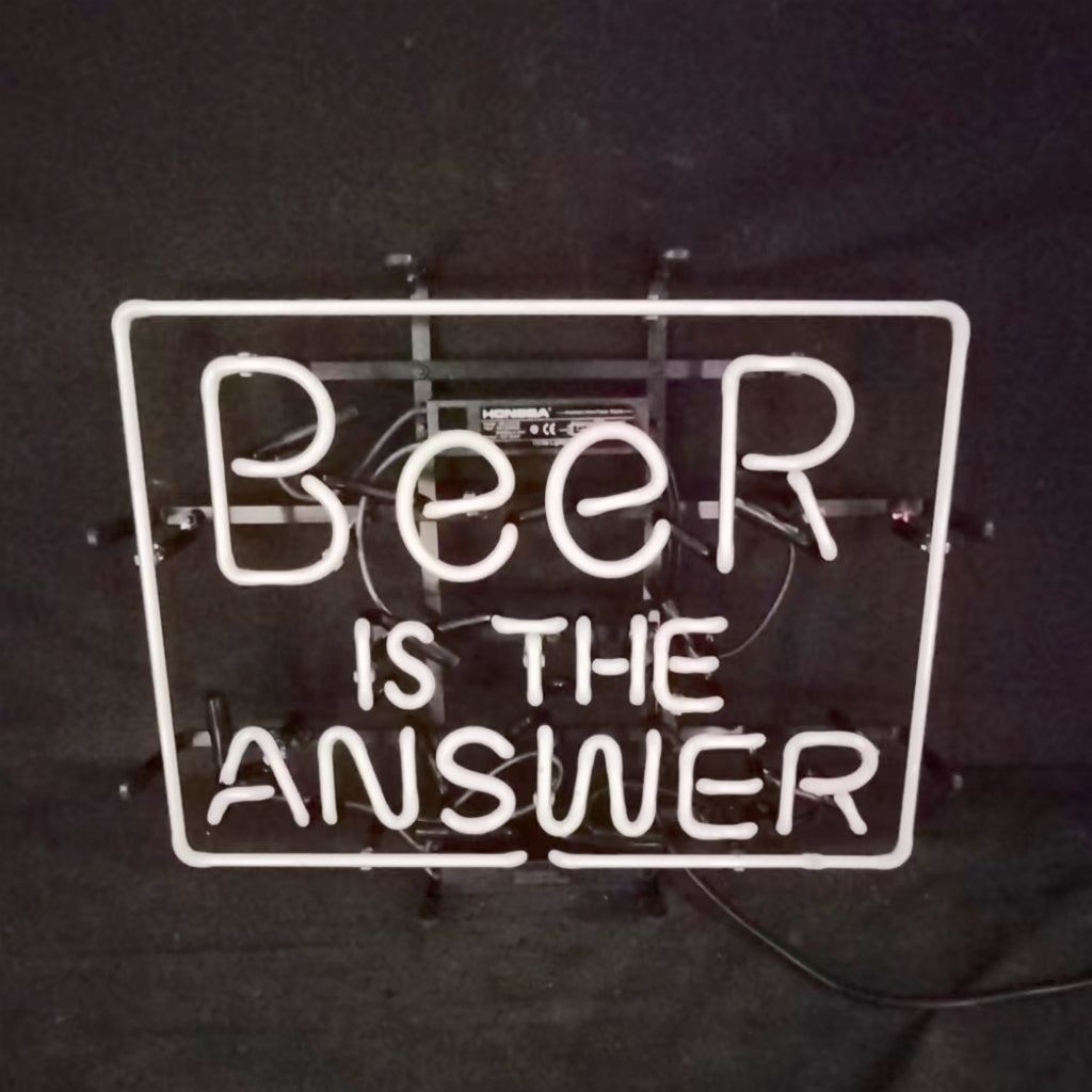 White neon light sign with the phrase "Beer is the Answer" inside a rectangular frame against a dark background.
