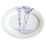 Oval white ceramic platter featuring a delicate blue birch tree illustration with subtle shadows and a carved heart containing initials on the trunk.