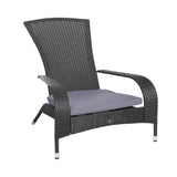 Black woven wicker lounge chair with curved armrests and a light gray seat cushion, shown against a white background.