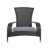 Black resin-wrapped wicker chair with curved armrests and a gray cushion on the seat, viewed from the front against a white background.