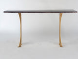 Rectangular black tabletop sofa table with two curved gold-colored split legs, shown against a plain white background.