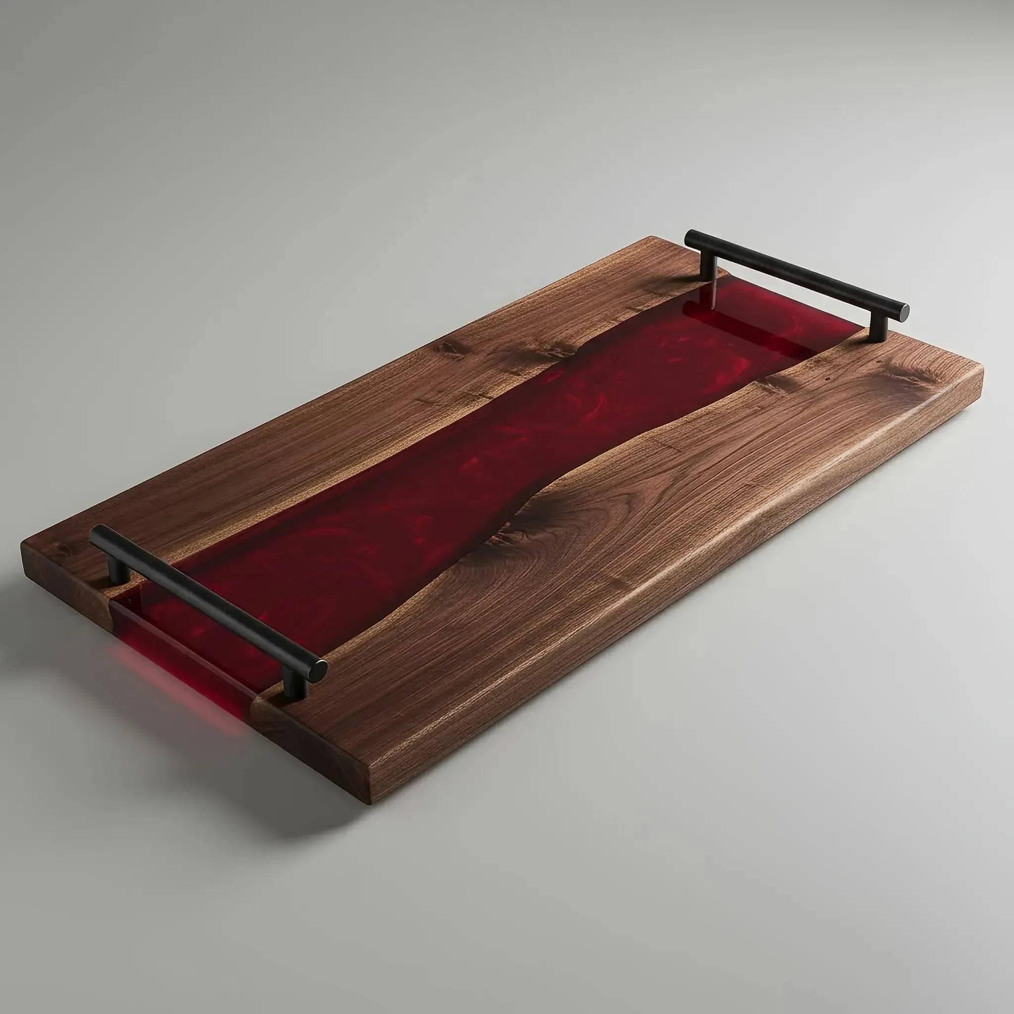 charcuterie board, 18 inches by 9 inches, made from live edge black walnut wood with a deep, glossy dark red epoxy river running through the center. The resin has a rich, translucent merlot or burgundy tone, offering a luxurious contrast against the walnut’s dark grain. Matte black metal handles at each end.