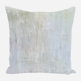 Square pillow with abstract pattern in soft blue, beige, and white brush strokes resembling a light rain effect.