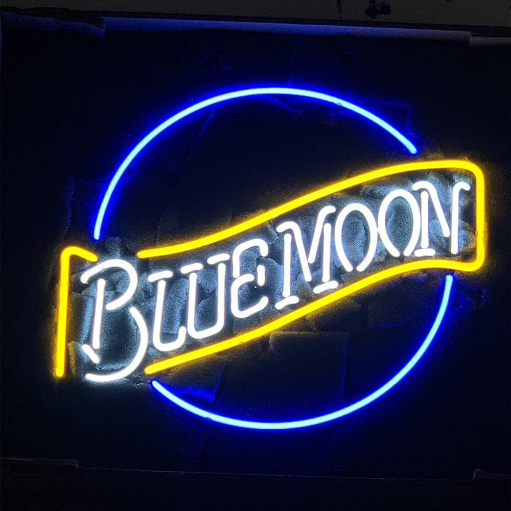 Blue Moon Beer Neon Light Sign glowing against a dark wall