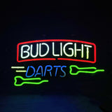 Neon sign with white and yellow 'BUD LIGHT' text framed in red above the word 'DARTS' in blue, accompanied by two green dart shapes on a black background.