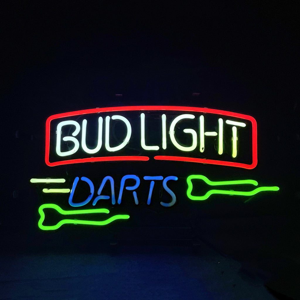 Neon sign with white and yellow 'BUD LIGHT' text framed in red above the word 'DARTS' in blue, accompanied by two green dart shapes on a black background.