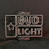 White neon light sign with a star and a stylized can design next to the words 'BUD LIGHT' in uppercase letters on a black background.
