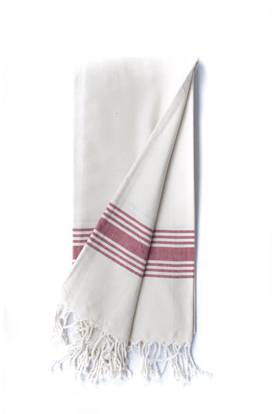Buenos Aires -White towel in white and blush tones displayed folded showing fringed ends