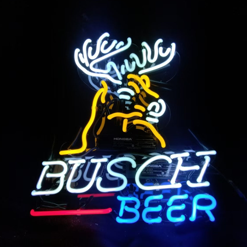 Neon sign featuring a stylized yellow deer head with white antlers above the text 'BUSCH' in white and 'BEER' in blue, with a red underline beneath.