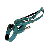 Turquoise blue embossed croc Italian leather dog collar, leash, and harness set with silver metal hardware and adjustable straps shown isolated on white background.