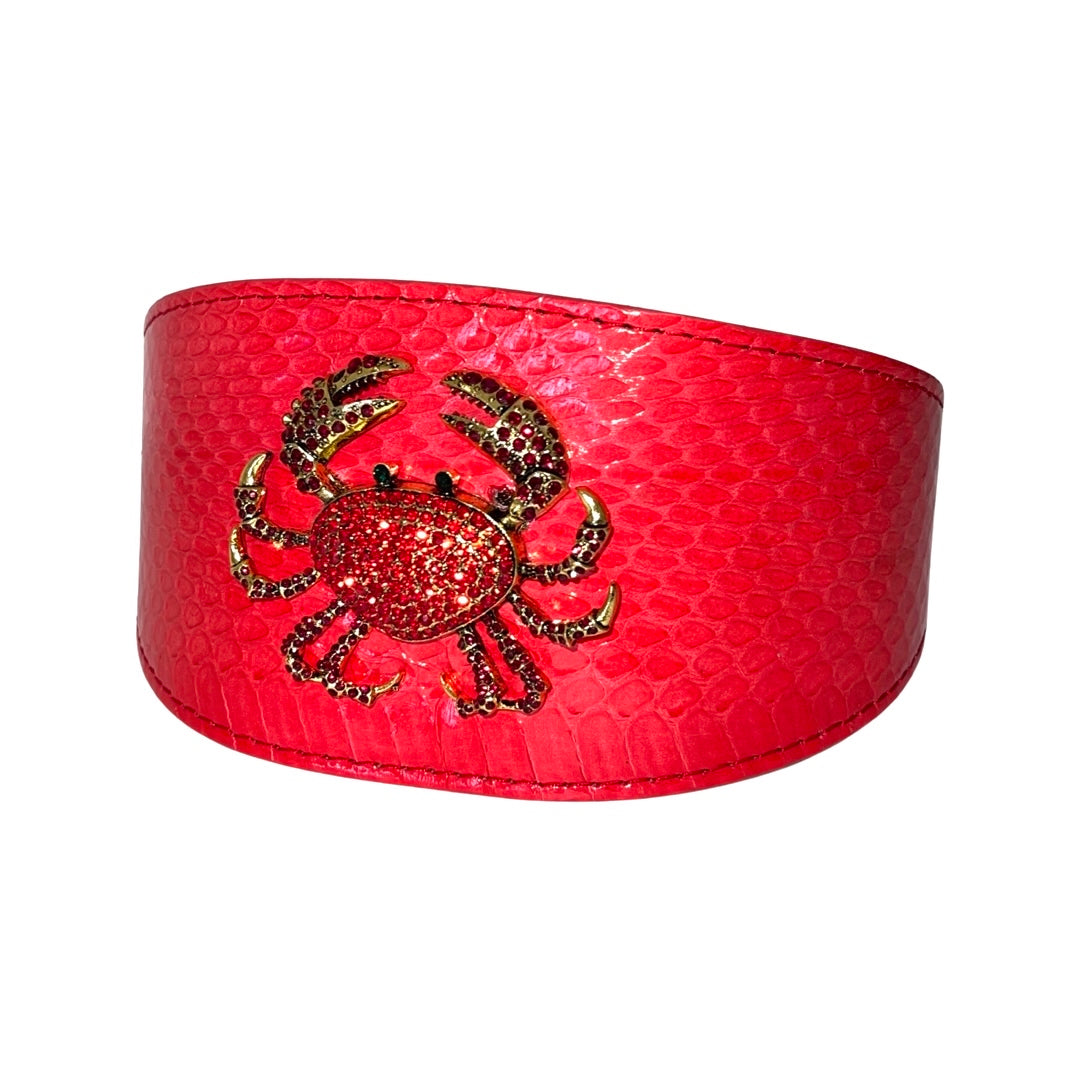 Red-orange wide collar with a textured snake pattern and a sparkling rhinestone crab accessory in the center.