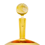 Amber glass bottle stopper with a rounded top featuring textured bubbles, tapering into a narrow neck inserted into a matching amber bottle opening.