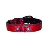Small red and purple metallic snake-textured collar with silver oval buckle and D-ring on a white background.