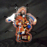 Neon sign featuring the Captain Morgan pirate in red coat holding a sword and standing with one foot on a barrel labeled 'Captain Morgan', with illuminated blue and orange accents.