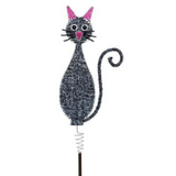 Decorative metal garden stake shaped like a black cat with pink ears and nose, round eyes, and a curled tail, mounted on a spring and rod base.