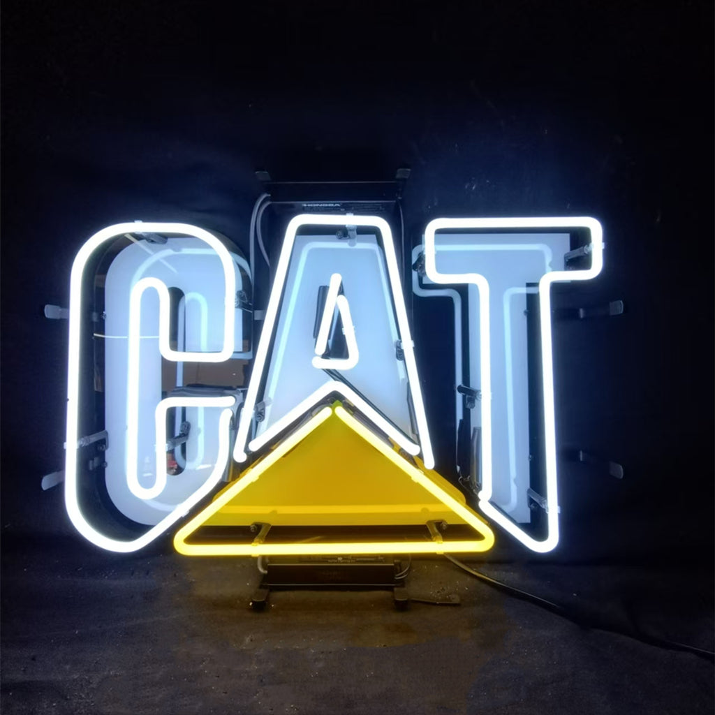 Neon sign displaying the word 'CAT' with white glowing letters and a yellow triangle beneath the letter A against a dark background.