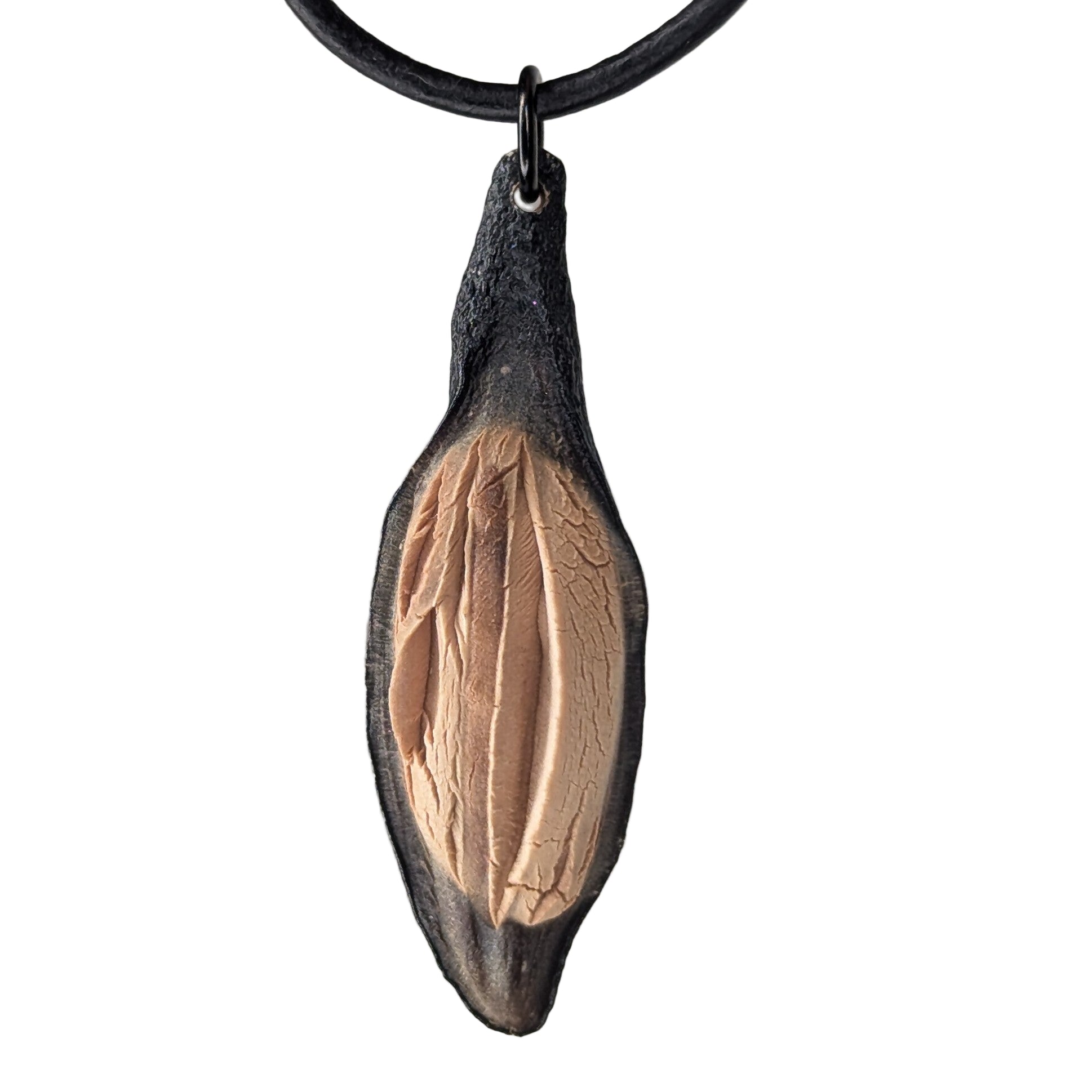 Caulerionyx necklace pendant by Versiliy shown on natural leather cord against neutral background