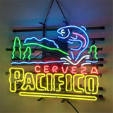 Neon sign with a jumping blue and pink fish above green trees and blue waves, displaying glowing red 'CERVEZA' and yellow 'PACIFICO' text.
