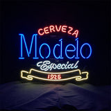 Neon sign displaying 'Cerveza' in red, 'Modelo' in blue, 'Especial' in white script, and '1925' in red within a yellow banner shape, on a black background.