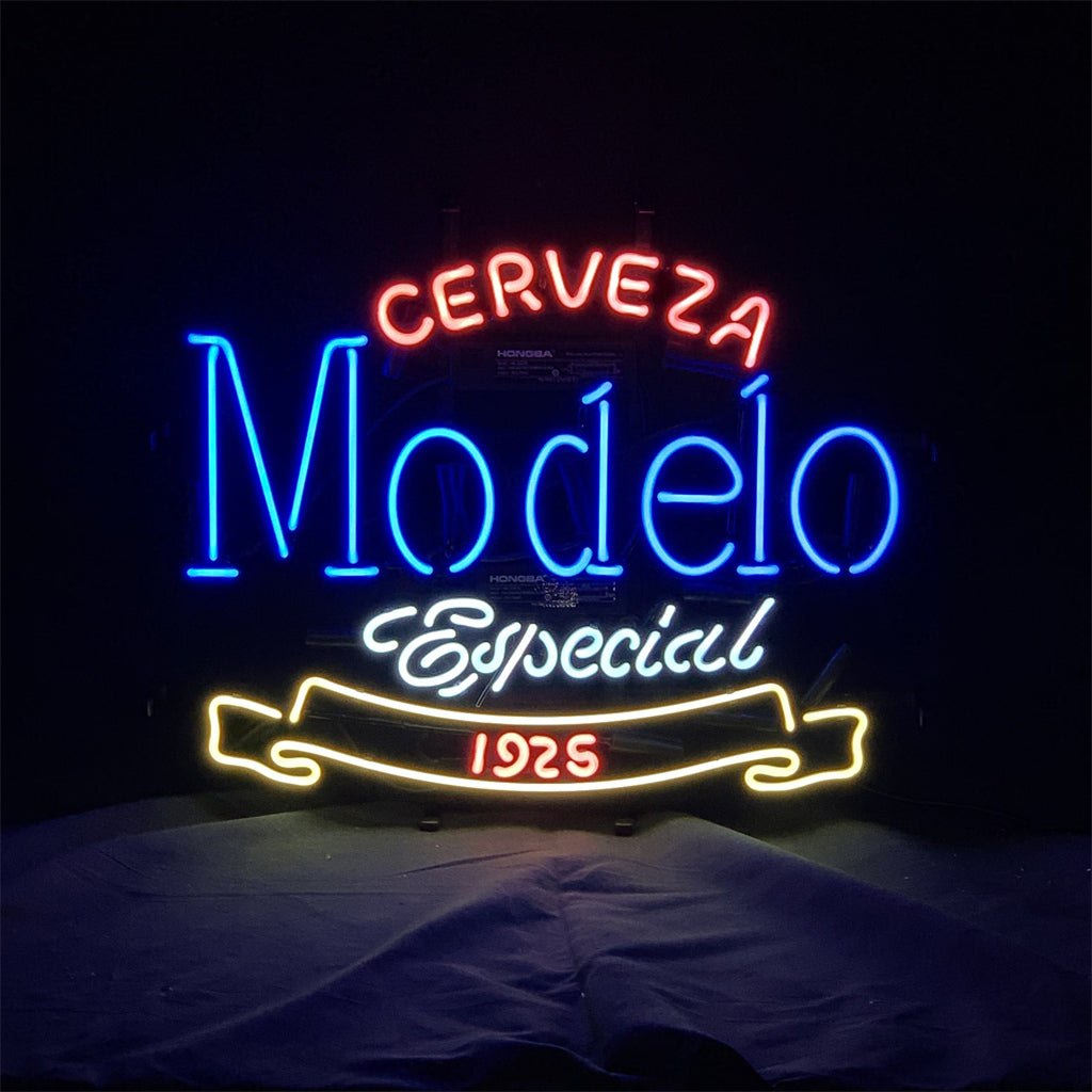 Neon sign displaying 'Cerveza' in red, 'Modelo' in blue, 'Especial' in white script, and '1925' in red within a yellow banner shape, on a black background.