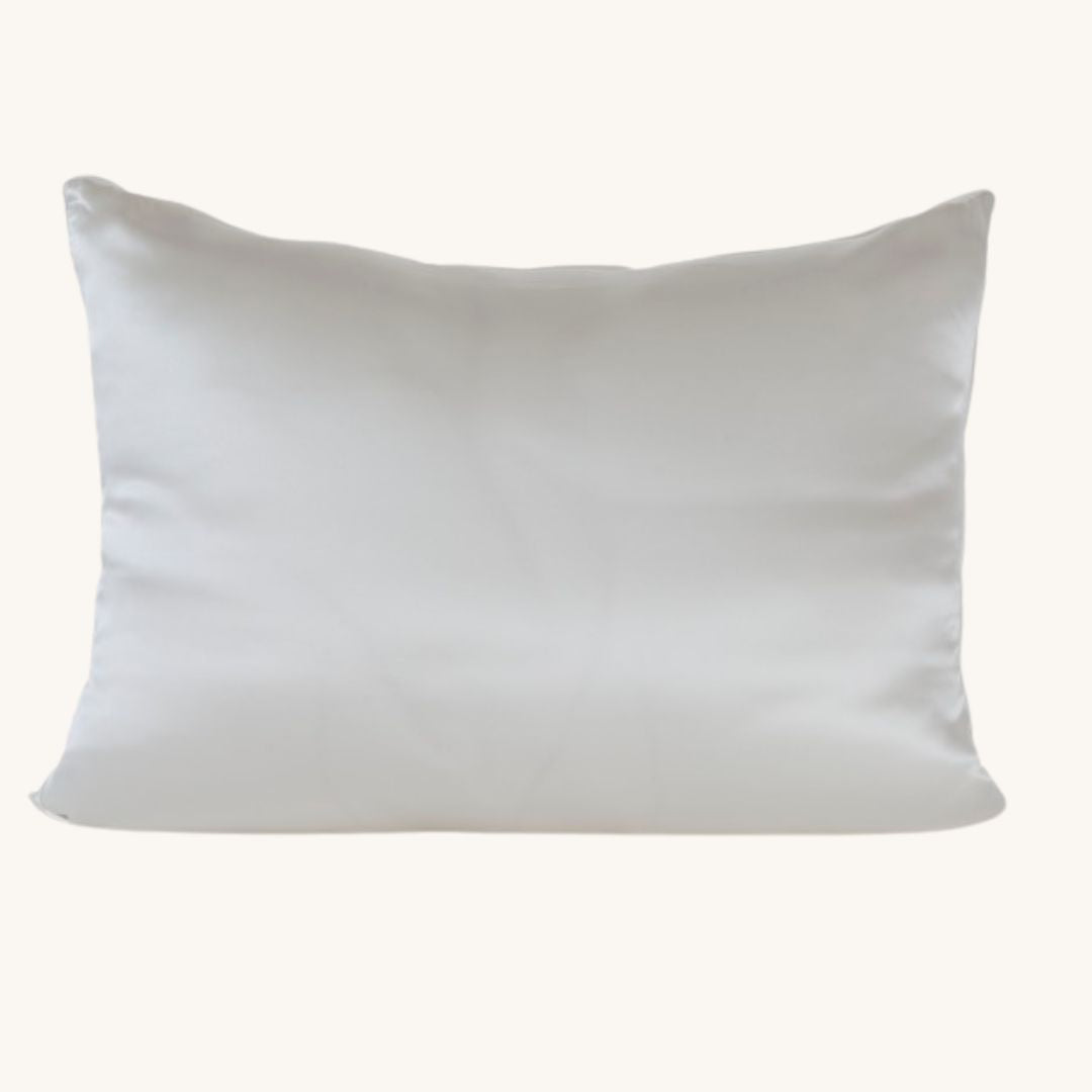White Charmeuse Silk Pillowcase with Mulberry Silk filled cushion insert on a bed