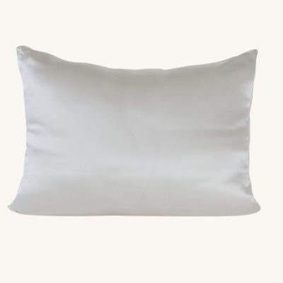 White Charmeuse Silk Pillowcase with Mulberry Silk filled cushion insert on a bed
