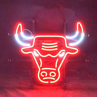 Chicago Bulls Neon Signs glowing with red neon lighting on a metal grid backing, hanging on a wall.