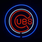Neon sign of the Chicago Cubs logo with a red 'C' and 'UBS' letters inside, outlined by concentric white and blue circles against a black background.
