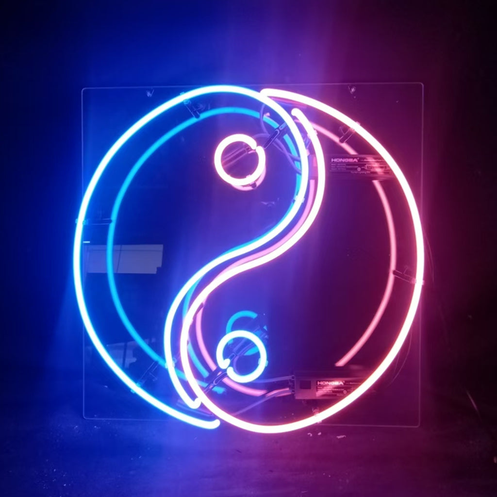 Chinese Yin Yang Neon Sign glowing with curved white and black light tubes on a square backing