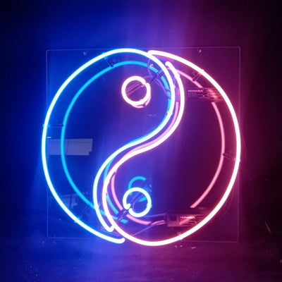 Chinese Yin Yang Neon Sign glowing with curved white and black light tubes on a square backing