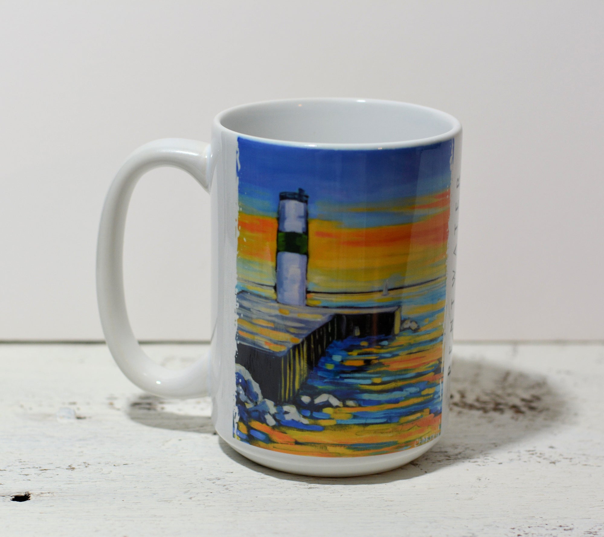 Ceramic coffee mug featuring Pentwater Lighthouse Sunset artwork by Christi Dreese