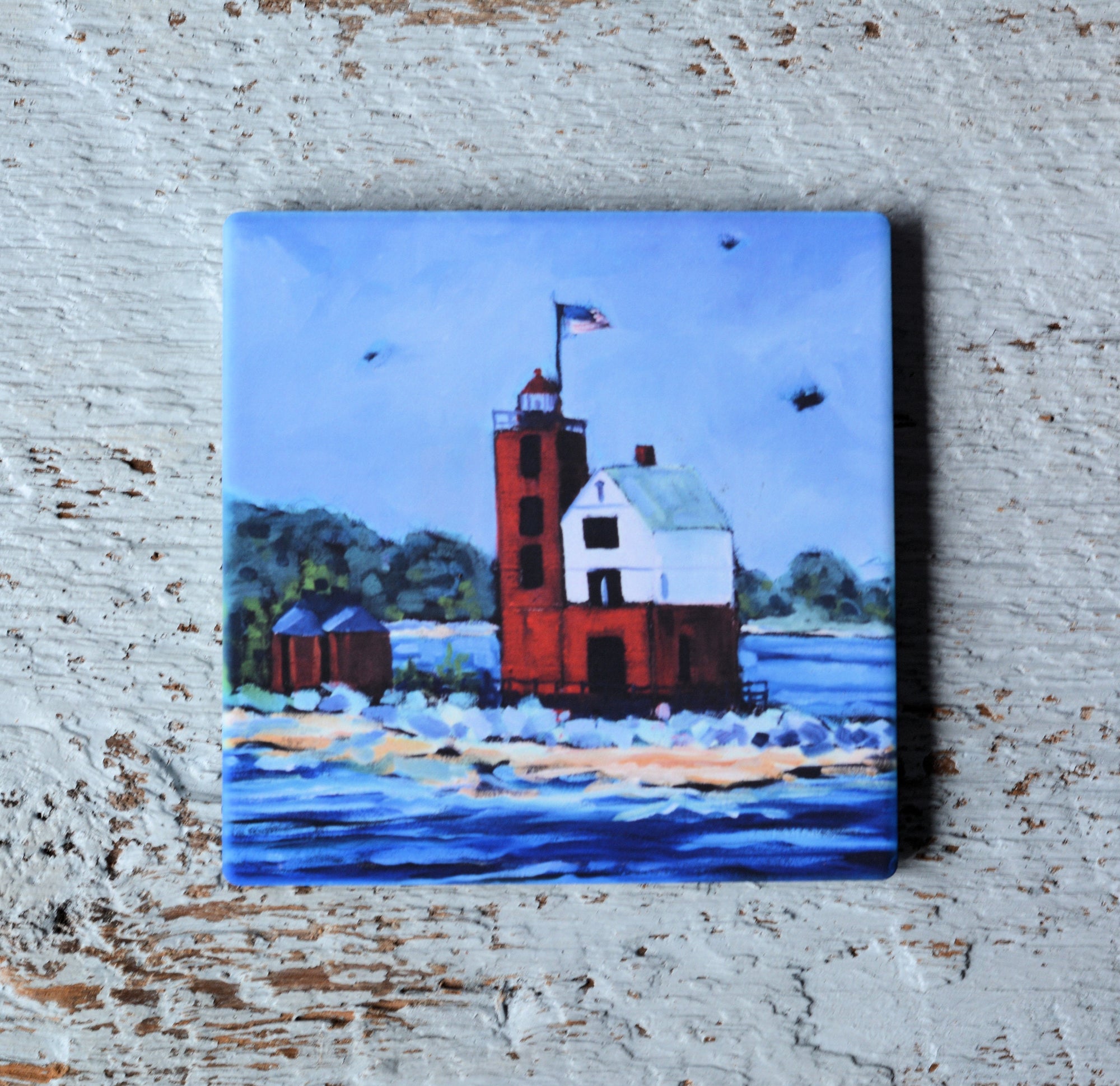 Round Island Lighthouse art coaster by Dreese Fine Art with bright, colorful design and cork backing