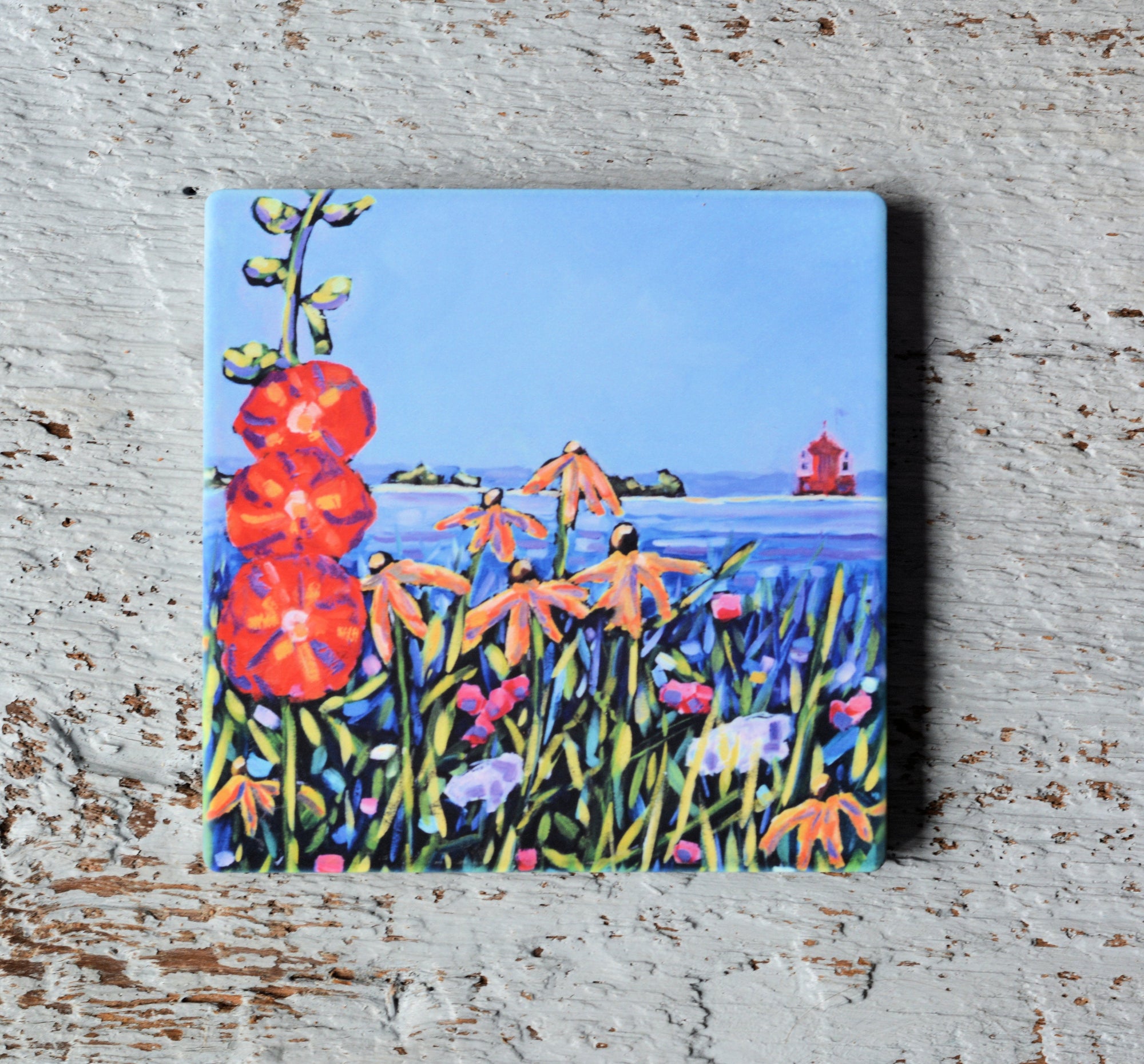 Coaster, trivet and magnet with floral artwork inspired by Mackinac Island hollyhocks and wildflowers