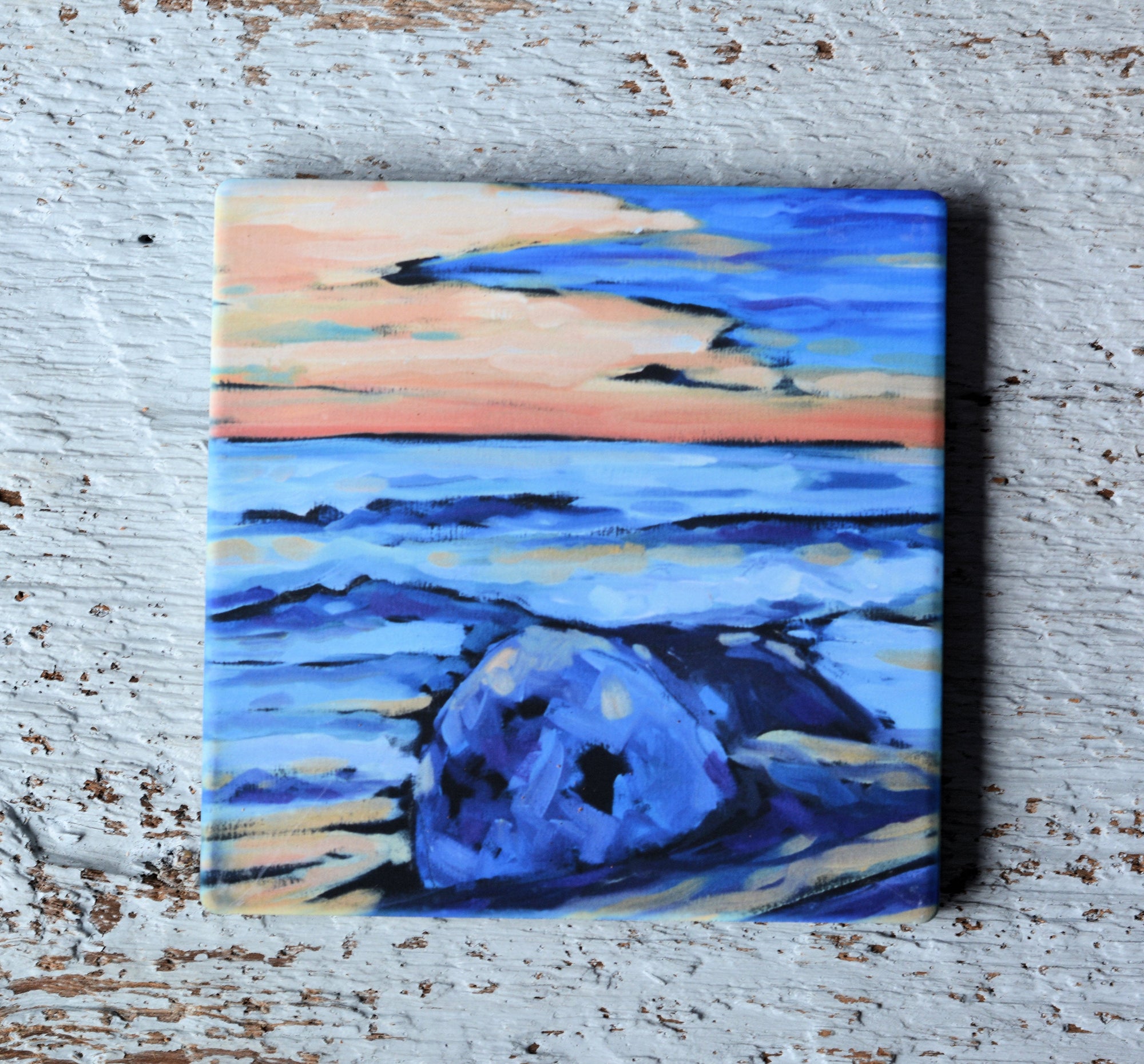 Colorful coaster, trivet, and magnet pieces featuring vibrant artwork by Christi Dreese