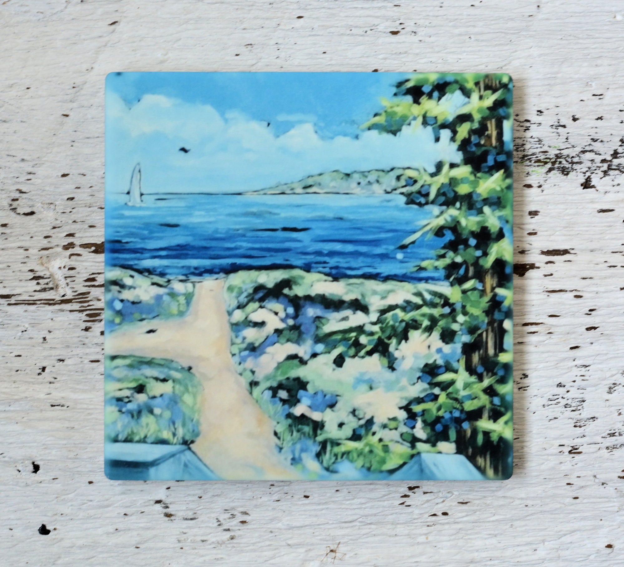 Coaster and trivet from Dreese Fine Art featuring bright lake-inspired artwork