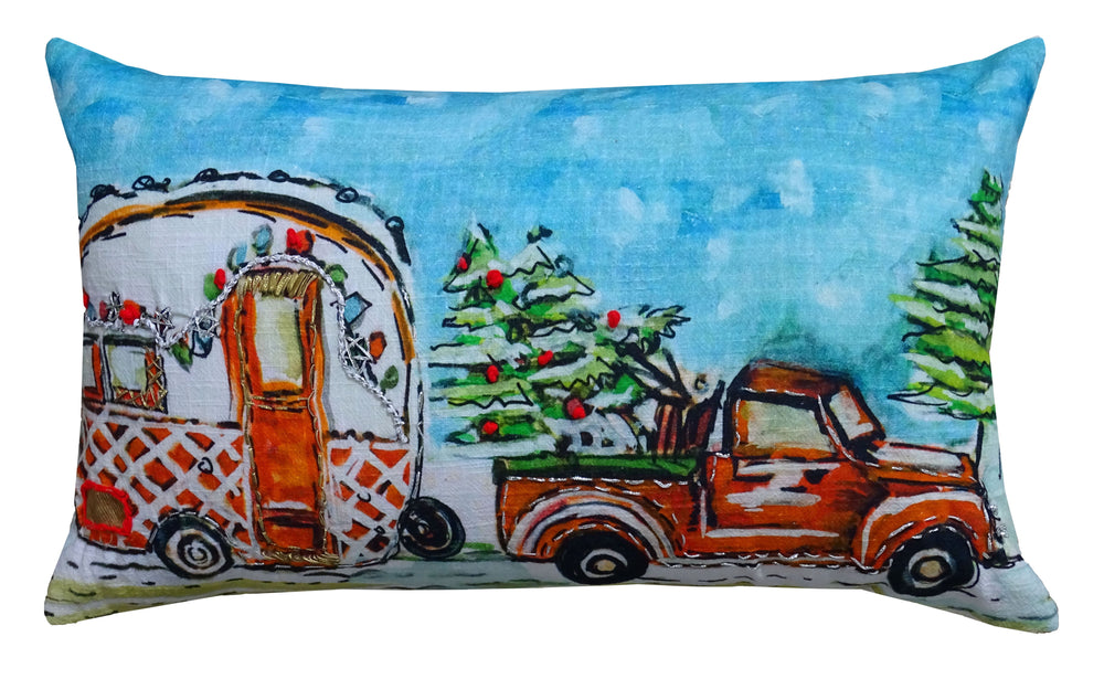 Hand Illustrated Christmas Cravan Holiday Pillow showing festive pattern in red and green tones on a sofa