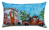 Hand Illustrated Christmas Cravan Holiday Pillow showing festive pattern in red and green tones on a sofa