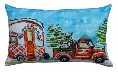 Hand Illustrated Christmas Cravan Holiday Pillow showing festive pattern in red and green tones on a sofa
