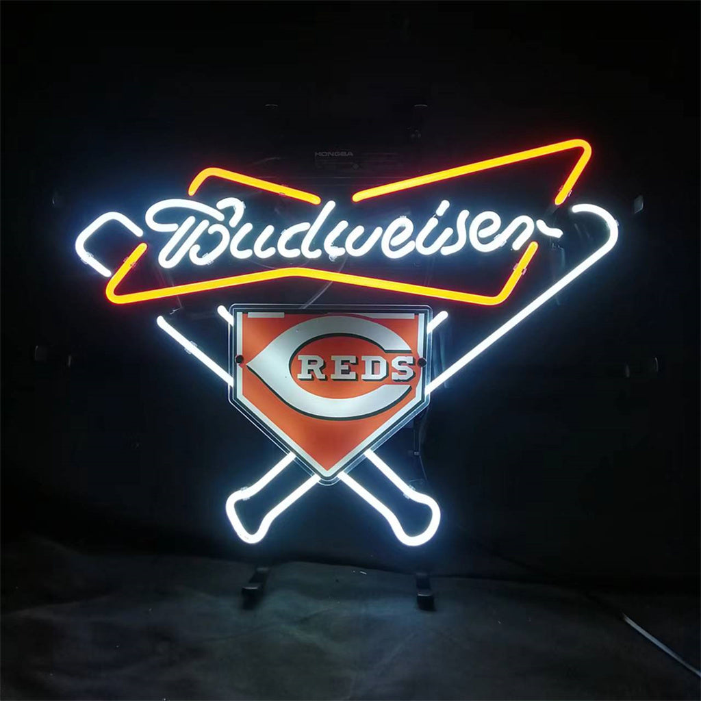 Neon sign featuring white and red Budweiser script above crossed baseball bats and a Cincinnati Reds home plate logo in orange and white on black background.
