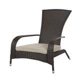 Dark brown woven wicker armchair with a high curved back and angled legs, featuring a cushioned beige seat pad.