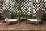 Pair of dark brown woven wicker armchairs with white cushions flanking a small matching wicker side table, set on a brick patio against a white lattice fence with greenery.